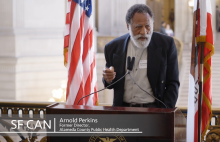 Arnold Perkins addresses the crowd gathered for the launch of the San Francisco Cancer Initiative at San Francisco City Hall.
