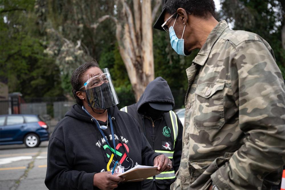Dr. Kim Rhoads at an Umoja Health event